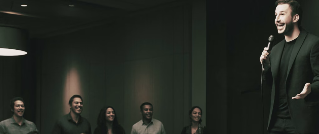 a comedian performs at a corporate event